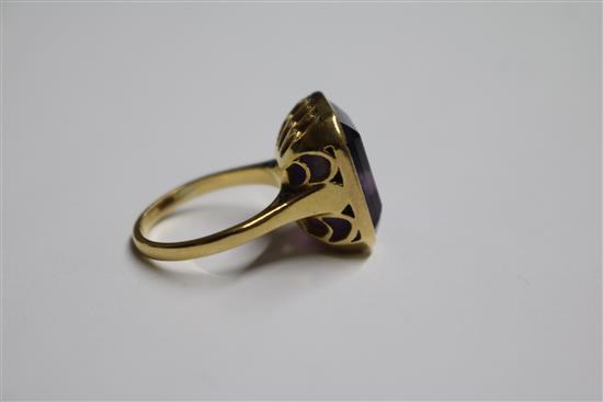 An 18ct gold and amethyst set dress ring, size M.